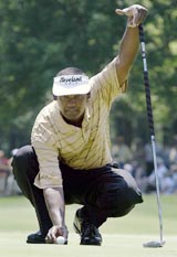 Fijian golfer Vijay Singh lines up a putt at the third hole on the third day of the Wachovia Championship in Charlotte, North Carolina