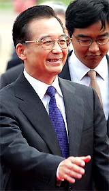 Chinas Premier Wen Jiabao smiles as he arrives at Heathrow airport in London 