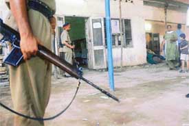 Security personnel keep vigil at a polling station in Chhawni Mohalla
