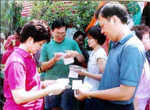 People from the Chinese community search their names in the voter list at China Town, east Kolkata