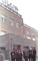 Indian banking sector experts stand in front of Da Afghanistan Bank. 