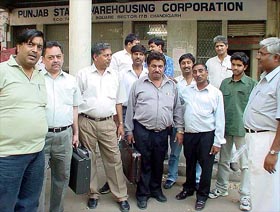 A group of traders, who had come to deposit their applications for the procurement of wheat, outside the Sector 17 office of the Punjab State Warehousing Corporation, Chandigarh. 