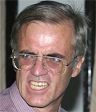Former Australian diplomat William Stuart Brown shouts at the Judge