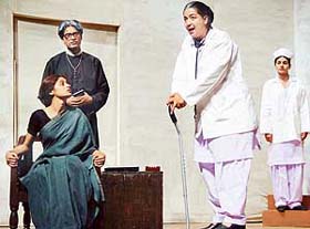 A scene from Kumar Vermas play "Teen Bhautikshastri" at Tagore Theatre, Chandigarh