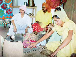 Students of the Department of Fine Arts participate during the installation of Different Strokes at Punjabi University in Patiala on Wednesday.