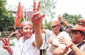 CPM activists celebrate the victory of their party candidates outside a counting centre in Kolkata on Thursday. 