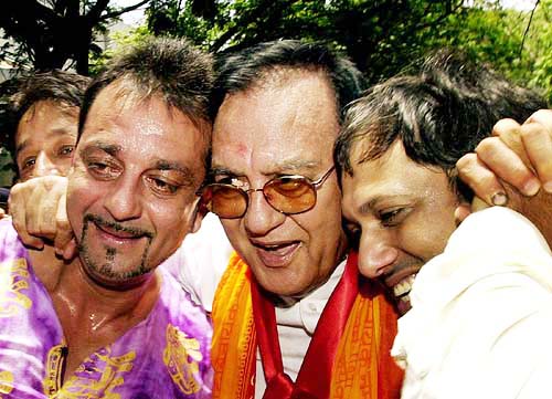 STAR POWER: Veteran Bollywood star Sunil Dutt with his actor son Sanjay Dutt and newly elected MP from Mumbai North Govinda celebrate their victory in Mumbai on Thursday.