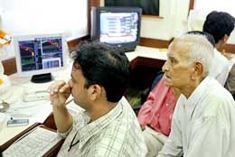 Stock brokers monitor dealings at the BSE in Mumbai on Friday. 
