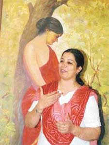 Ms Kiran Soni Gupta, an IAS officer, stands before one of her paintings at an exhibition at Sutlej Club