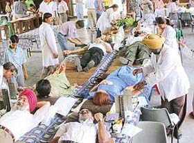 Volunteers donate blood at a camp organised by St Johns Old Boys Association (SJOBA) at St Johns School in Sector 26, Chandigarh