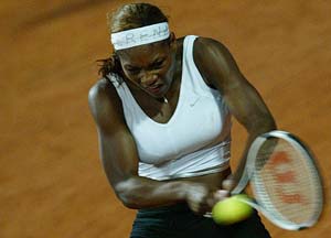 Serena Williams of the US hits a backhand return to Russia's Svetlana Kuznetsova 