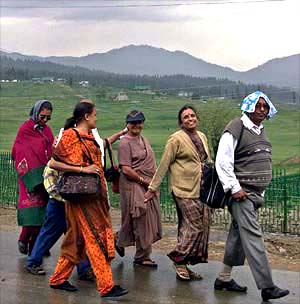 A tourist family walks in Gulmarg, 55 km west of Srinagar, on Sunday