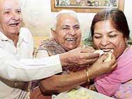 Mother and grandparents of Raghu Mahajan, who stood first among students of Chandigarh schools in the ICSE Class X examination, celebrate his success