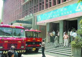 Fire vehicles outside the Allahabad Bank at Parliament Street where a fire call was received in the Capital
