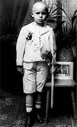 Karol Wojtyla, later known as Pope John Paul II, poses with a candle after receiving his First Communion in Krakow, Poland, in this undated file photogr