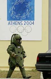 A bomb disposal expert checks a car during an exercise at a military camp in Agios Stefanos, about 10 miles north of Athens, on Wednesday. 