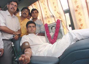 Newly elected MP Sachin Pilot donating blood on the occasion of Martyrdom Day of Rajiv Gandhi. East Delhi MP Sandeep Dikshit looks on.