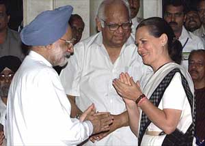 Prime Minister Manmohan Singh is greeted by Congress President Sonia Gandhi and senior CPI-M leader Somnath Chaterjee after the swearing-in ceremony at Rashtrapati Bhavan in New Delhi on Saturday.