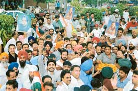 Congress activists celebrate the formation of the Congress-led government at the Centre, headed by Dr Manmohan Singh, in Ludhiana