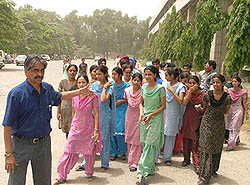 Inmates of the girls hostel of Guru Gobind Singh Medical College, Faridkot, along with Principal J. S. Dalal, hold a demonstration in front of the SSPs office in Faridkot on Sunday. 