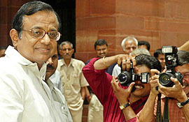 Indias new Finance Minister P. Chidambaram arrives for work after assuming office in New Delhi on Monday.