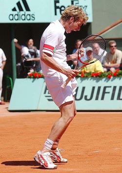 France's Jerome Haehnel reacts as he faces USA's Andre Agassi in their first round match
