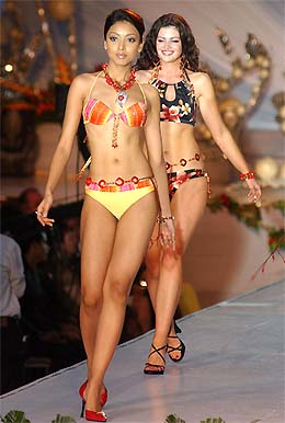 Tanushree Dutta, Miss India Universe 2004, and Cathriona Duignam, Miss Ireland Universe 2004, walk the ramp in swimsuits at the 2004 Miss Universe Fashion Show in GuGuayaquil