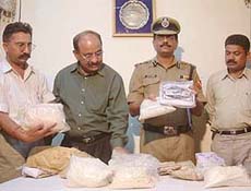 Mr Hemant Purohit, DIG, shows heroin seized from a Pakistani intruder in Amritsar