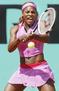 Serena Williams of the USA backhands to Czeck Republic's Iveta Benesova during the first round match of the French Open tennis tournament at the Roland Garros stadium