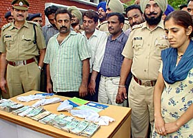 Notorious criminal Anil Kumar Tota, his gang members and concubine Yogita, in police custody in Chandigarh on Wednesday