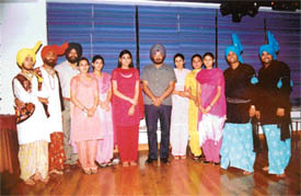 Punjabi film actress Kimi Verma with a group after the shooting of a Punjabi song in Ludhiana
