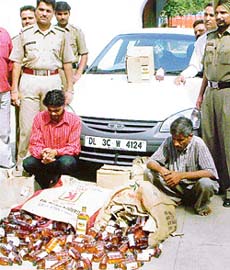 Sandeep Kumar and Shamsher Singh, who were arrested for smuggling liquor by the Dera Bassi police