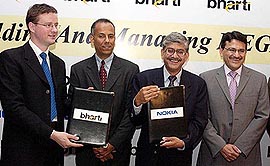 President of Bharti Televentures Manoj Kohli with Country Head of Nokia networks Ashish Chowdhary during the Bharti, Nokia pact in Mumbai