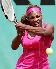 Serena Williams of the US returns a backhand to Silvija Talaja of Croatia 