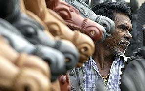 A vendor waits for customers at his makeshift shop