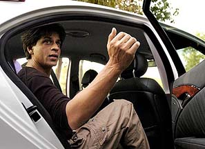 Bollywood star Shahrukh Khan gestures while talking to mediapersons