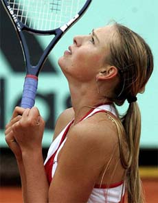Maria Sharapova of Russia reacts after defeating Marlene Weingartner of Germany in the French Open at Roland Garros stadium in Paris