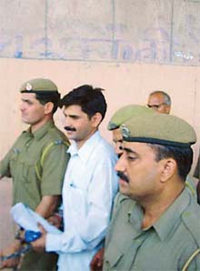 Sanjiv Kumar, who was convicted for the murder of his father-in-law Relu Ram Punia and his family members, comes out of court in Hisar on Monday.  