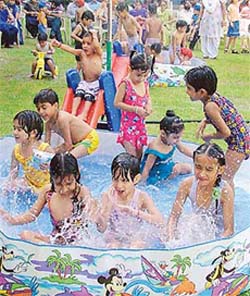 Tiny tots of BCM school in Ludhiana enjoy a "get wet" party arranged for them