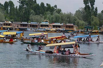 Tourists enjoy a shikara ride in Dal Lake, Srinagar