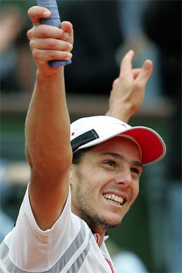 Gaston Gaudio of Argentina reacts after his quarterfinal win over Lleyton Hewitt of Australia 