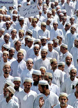 The Muslims walk during a silent march in protest against the US-led coalition in Iraq