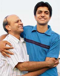 Bhuvnesh Aggarwal, who got 9th rank in the CBSE-PMT, is hugged by his father in Ludhiana 