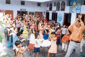 Students of New S.M.D. Senior Secondary School dance at a summer camp in their school