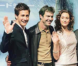 Dennis Quaid (Centre) with the cast of the new action thriller The Day After Tomorrow Jake Gyllenhaal (left) and Emmy Rossum during a photo call in Tokyo recently. The film opened in theatres throughout Japan