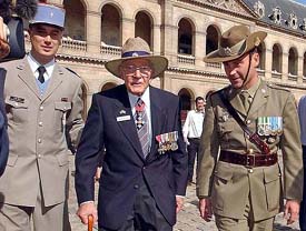 Australian World War II veteran William Robertson (centre) is escorted by soldiers after he received the Legion of Honour medal during a ceremony at the Invalides Military Museum in Paris on Saturday.
