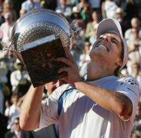 Gaston Gaudio of Argentina celebrates after the mens final at the French Open tennis tournament against his compatiot Guillermo Coria at Roland Garros stadium 