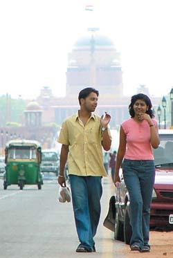 A couple takes a stroll on the Rajpath after a drizzle brought down the mercury in the Capital on Tuesday.