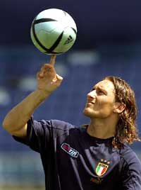 Italian striker Francesco Totti spins the ball during the teams first training session in Lisbon