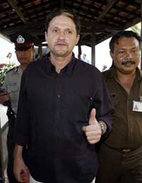 Indonesian officials guard Brazilian Marco Archer Cardoso Moreira after he was sentenced to death on Tuesday. 